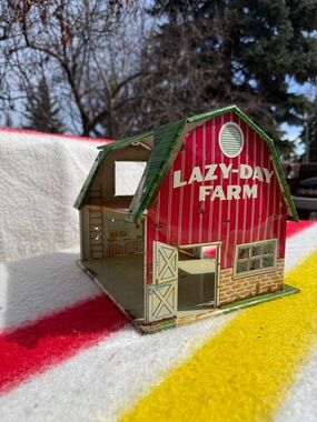 vintage collectible is a 1950s Louis Marx "Lazy-Day Farm" toy barn